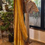 Mustard Bandhani Saree With Off-White Patola Highlighted Blouse