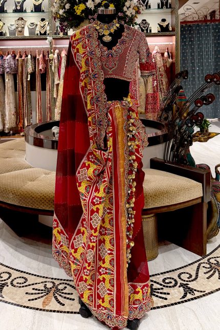 Maroon Patola Highlighted Heavy Tassels Saree with Maroon Embroidered Blouse